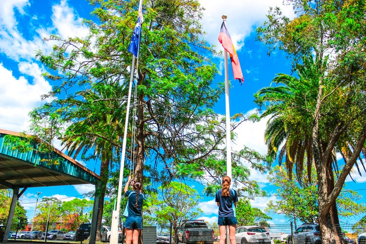 Student leaders raise the flags every day.