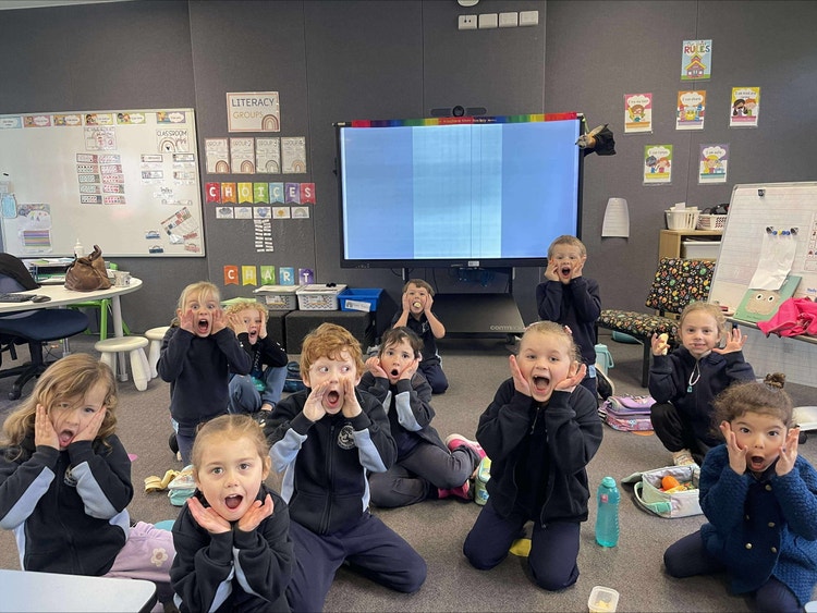 Students enjoying stories in our vibrant classrooms.